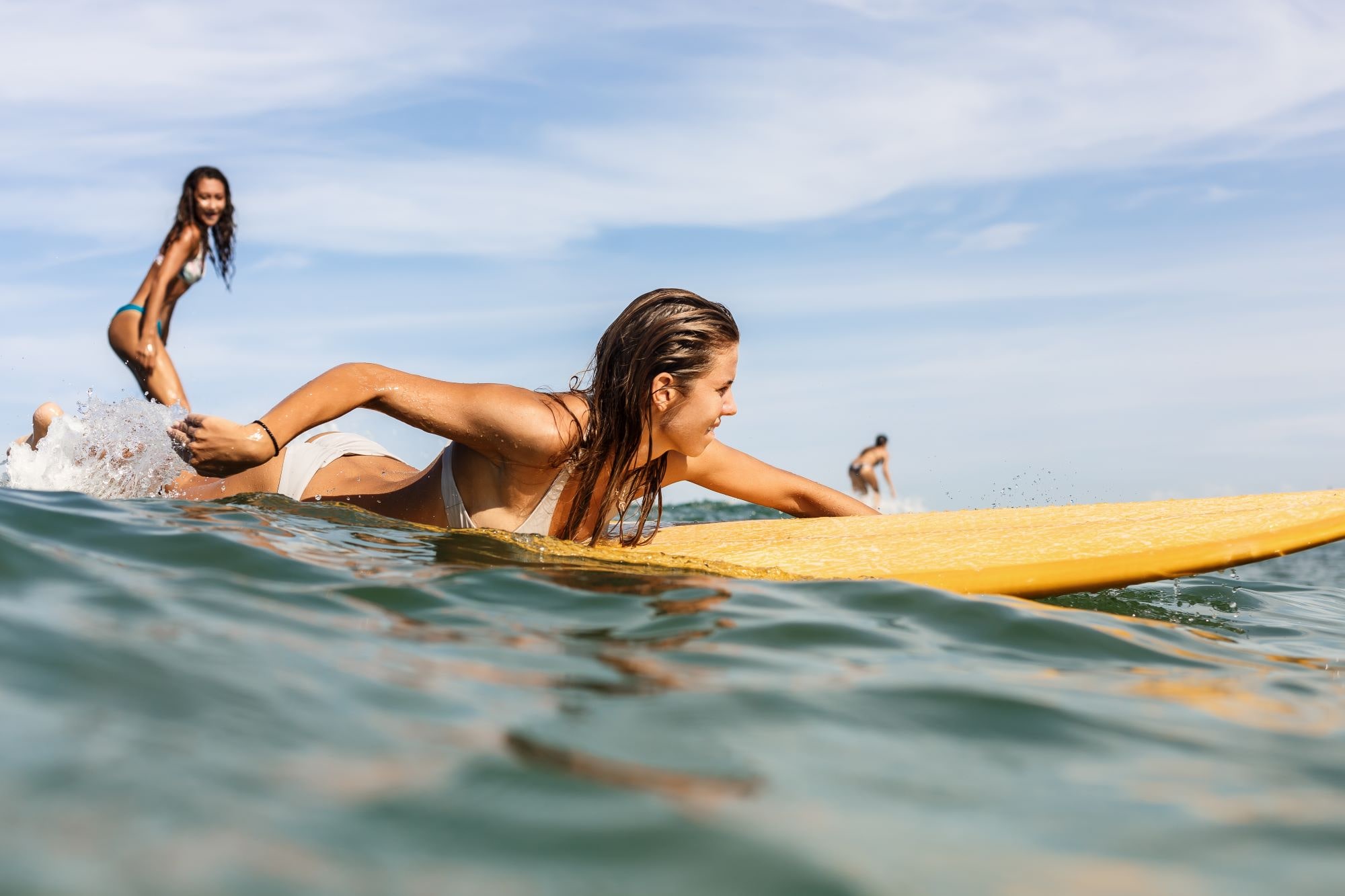 How to paddle on a surfboard